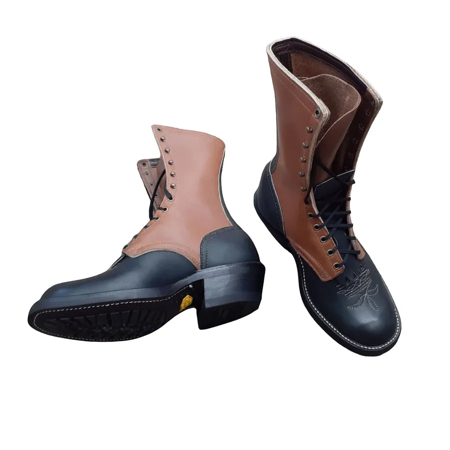 A pair of two-tone lace-up packer boots, black on the foot and tan on the shaft, with a riding heel, on a white background.
