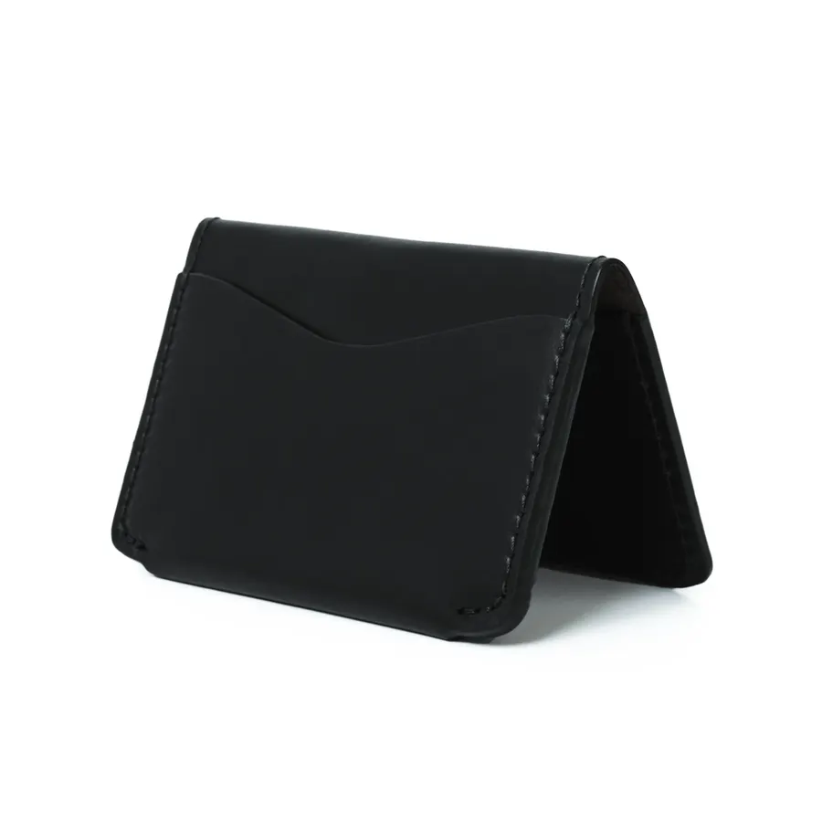 A black leather trifold wallet with a front card pocket and visible stitching, standing open at an angle on a white background.