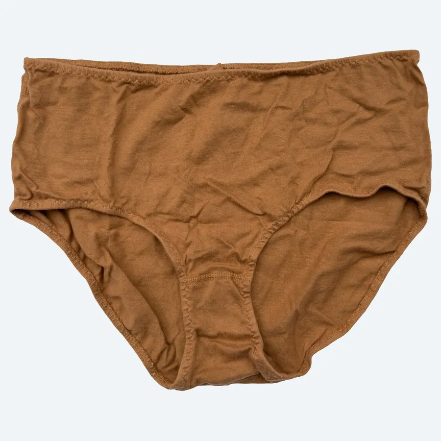 Tan high-rise cotton underwear briefs, laid flat against a pale grey background.